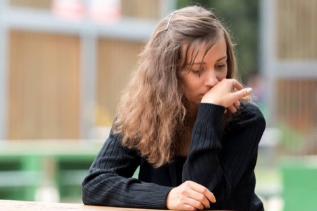 A woman who appears stressed