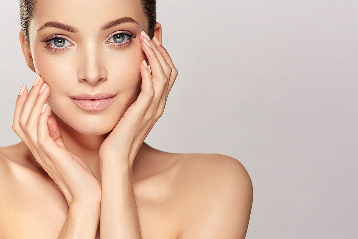 A woman suffering from a headache or migrane